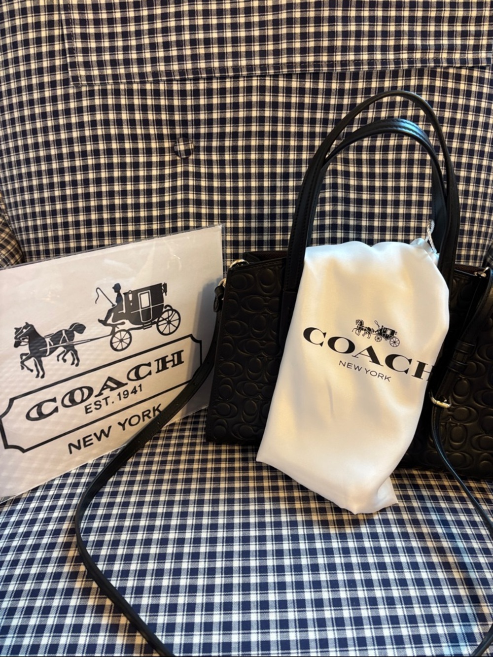 Coach Charlie carry  all Black Embossed leather with branded  Dust Bag